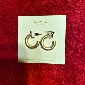 Sanctuary gold in color earrings.